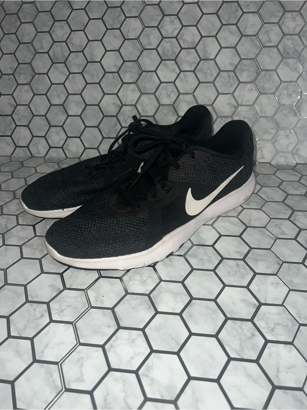 Nike Women’s Black Running Shoes with White Swoosh